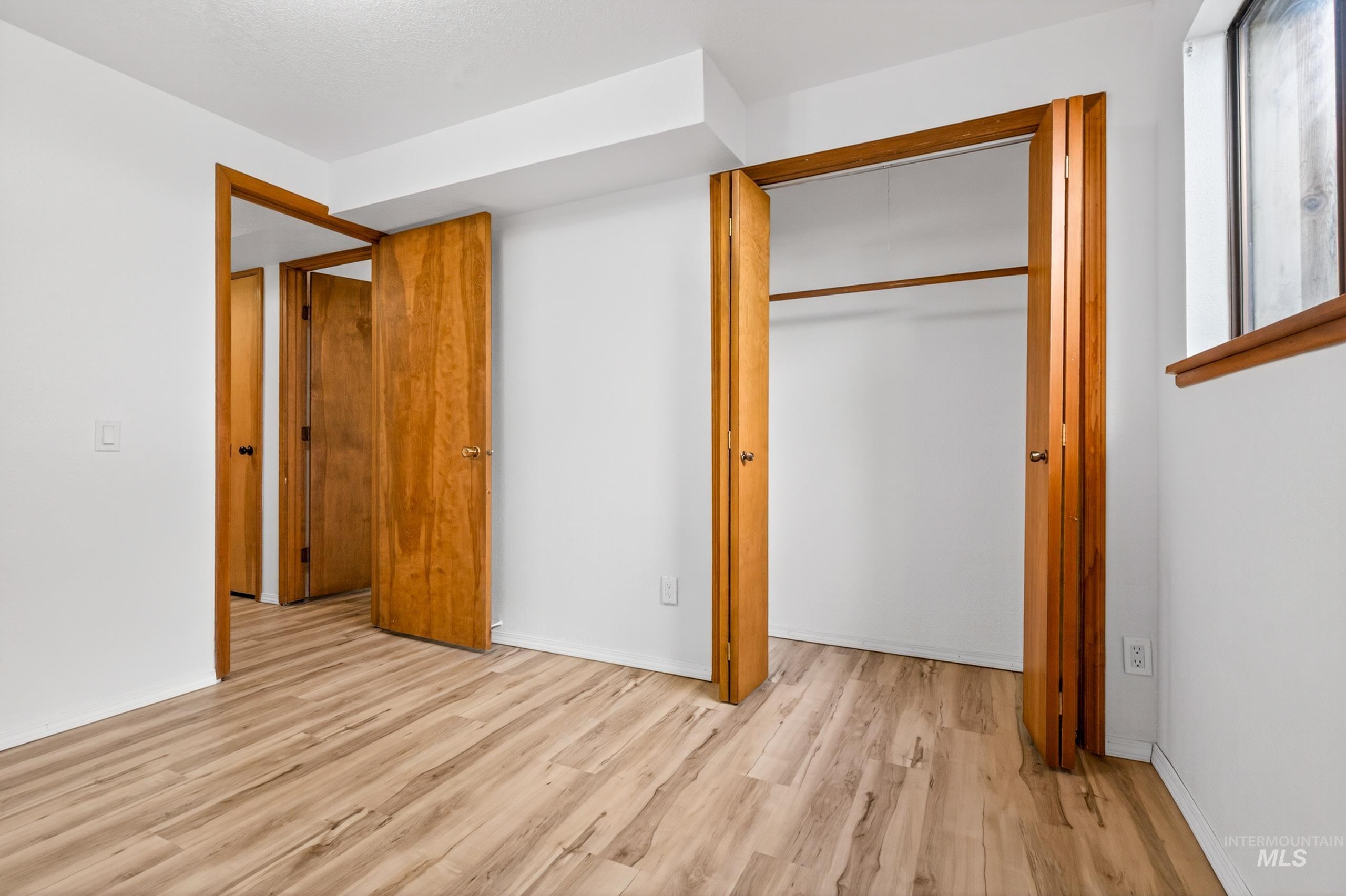 8989 Hillview Road Emmett, ID 83617 - Photo 41 of 50 Unfurnished bedroom with light wood finished floors and a closet
