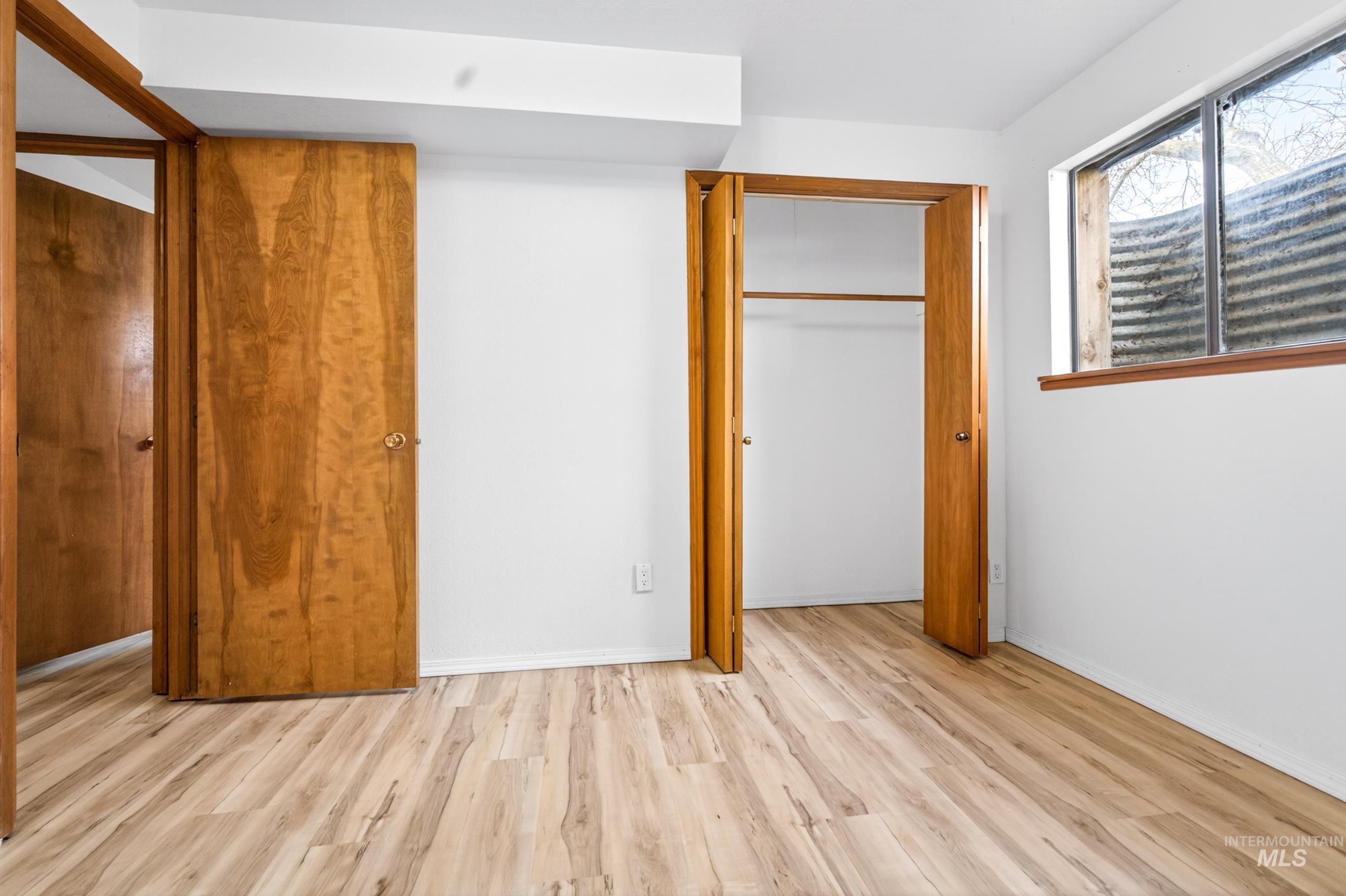 8989 Hillview Road Emmett, ID 83617 - Photo 42 of 50 Unfurnished bedroom with light wood finished floors and a closet