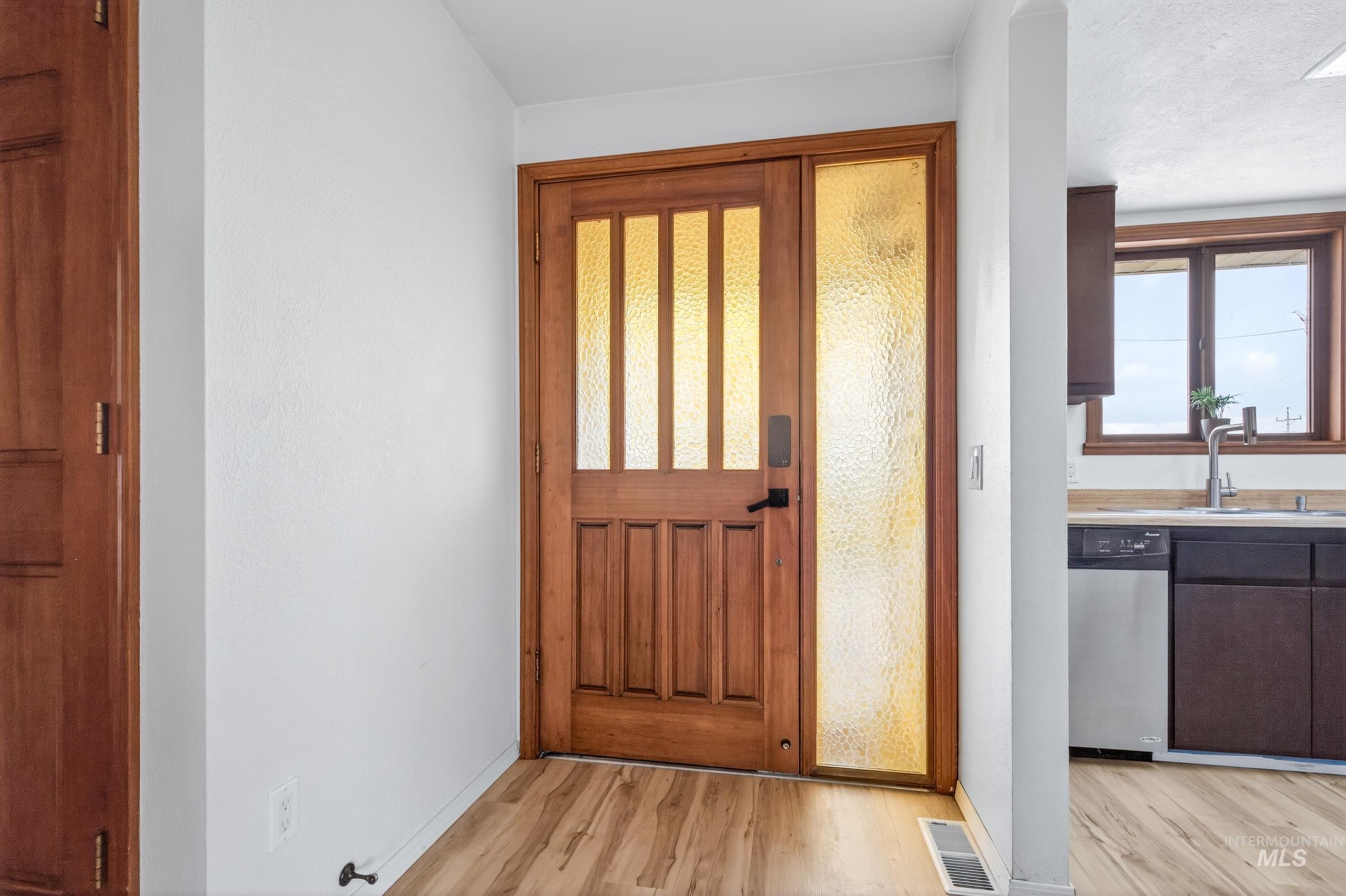 8989 Hillview Road Emmett, ID 83617 - Photo 7 of 50 Foyer featuring light wood-type flooring and baseboards