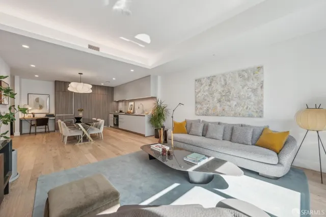 a living room with furniture and a table