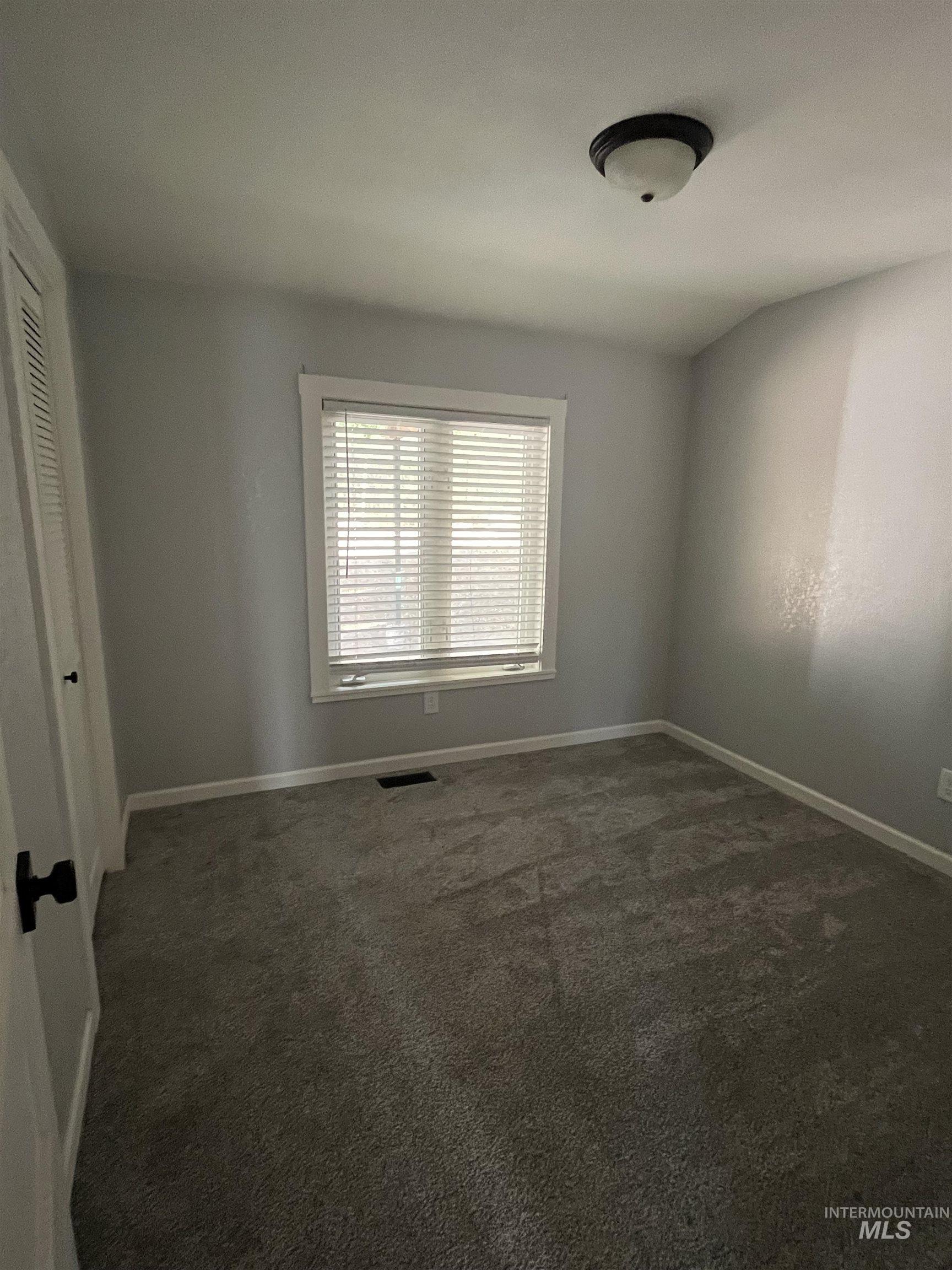 1024 El Cajon Street Moscow, ID 83843 - Photo 18 of 49 Unfurnished bedroom with carpet flooring and a closet