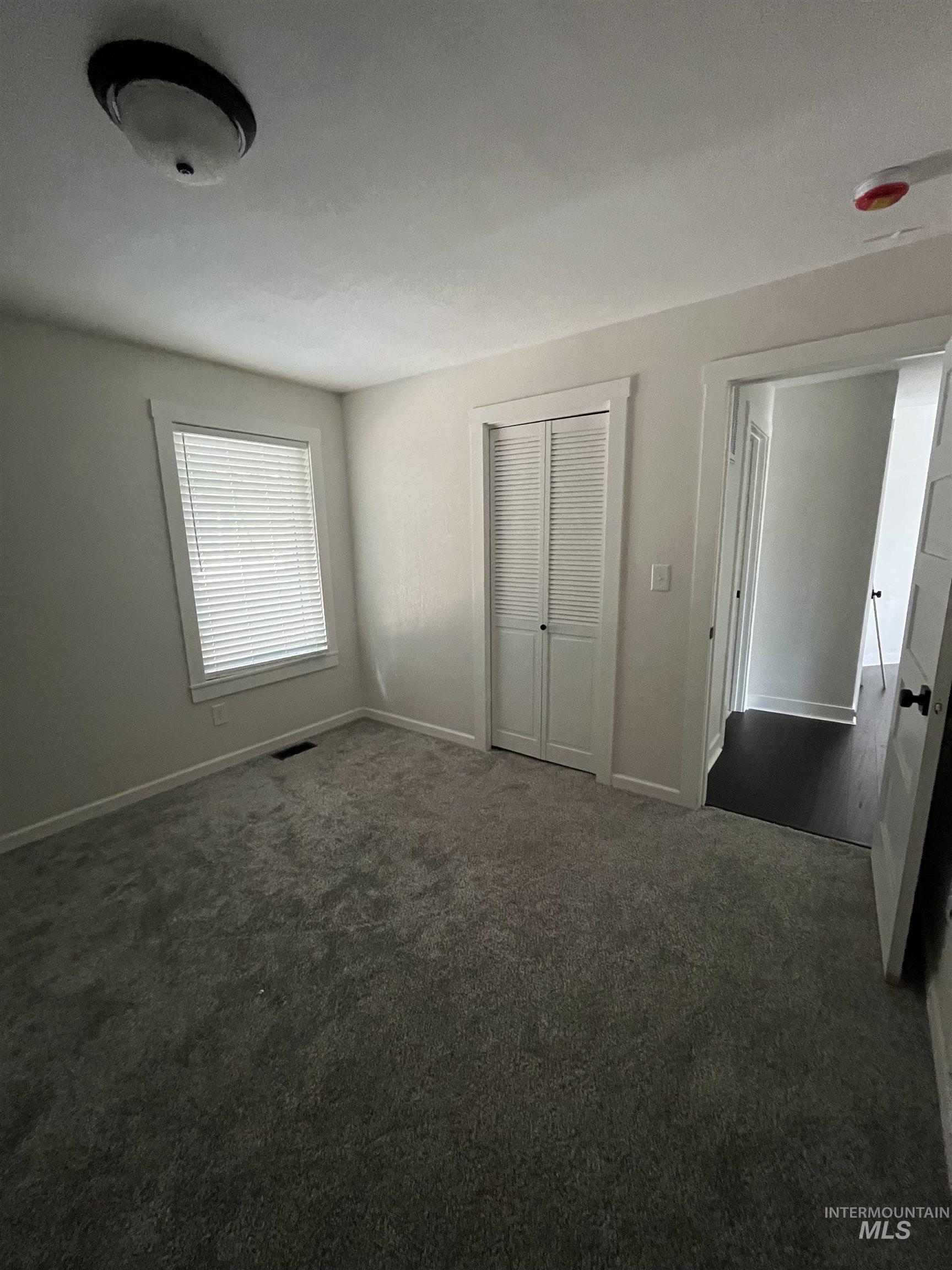 1024 El Cajon Street Moscow, ID 83843 - Photo 20 of 49 Unfurnished bedroom with carpet flooring and a closet