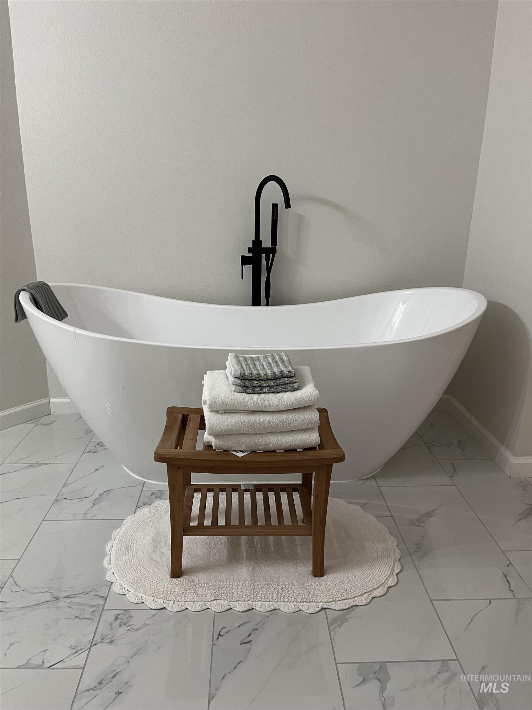1024 El Cajon Street Moscow, ID 83843 - Photo 28 of 49 Bathroom view of baseboards and a freestanding tub