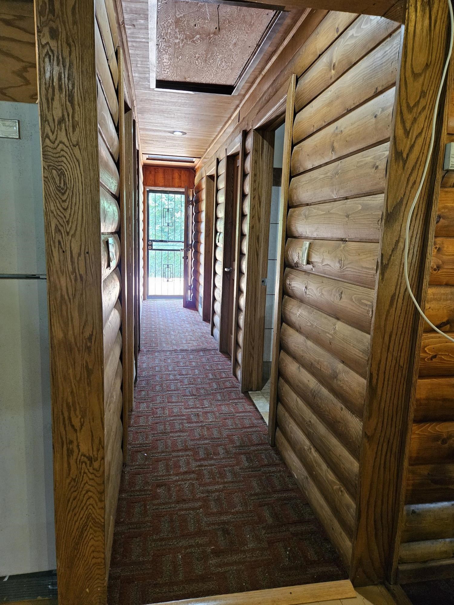 10221 Getz Road Mount Carroll, IL 61053 - Photo 10 of 23 a view of entryway with stairs and a wooden door