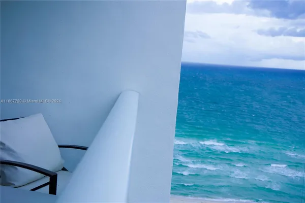 a view of balcony with wooden floor