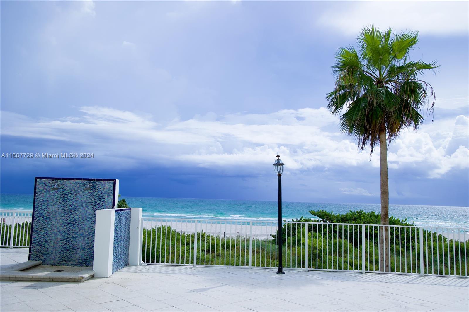 5601 Collins Avenue, Unit 1614 Miami Beach, FL 33140 - Photo 3 of 19 a street view along with residential houses