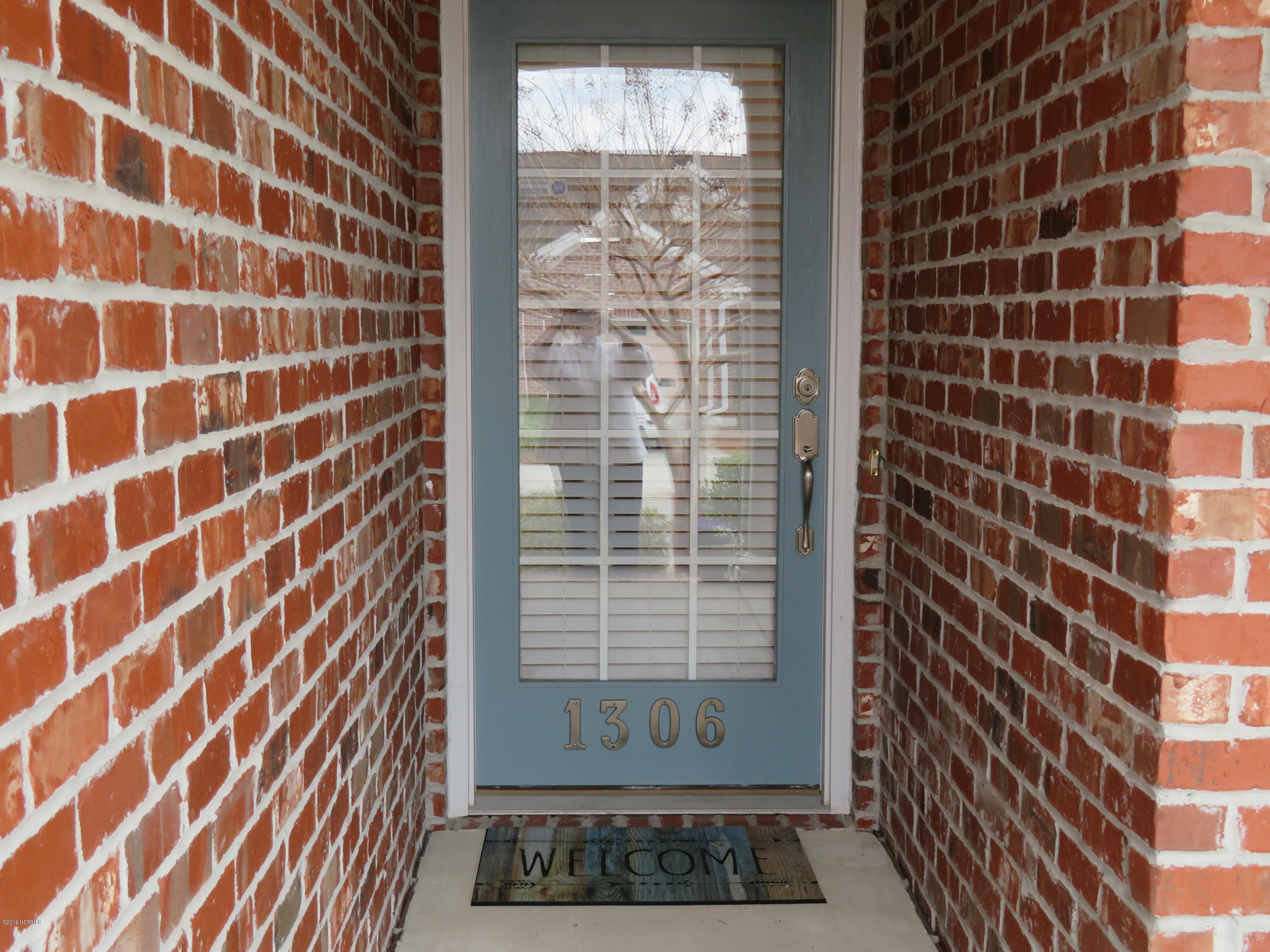 1306 Arbor Ridge Way Leland, NC 28451 - Photo 12 of 21 All brick front Entry and access to covered front porch