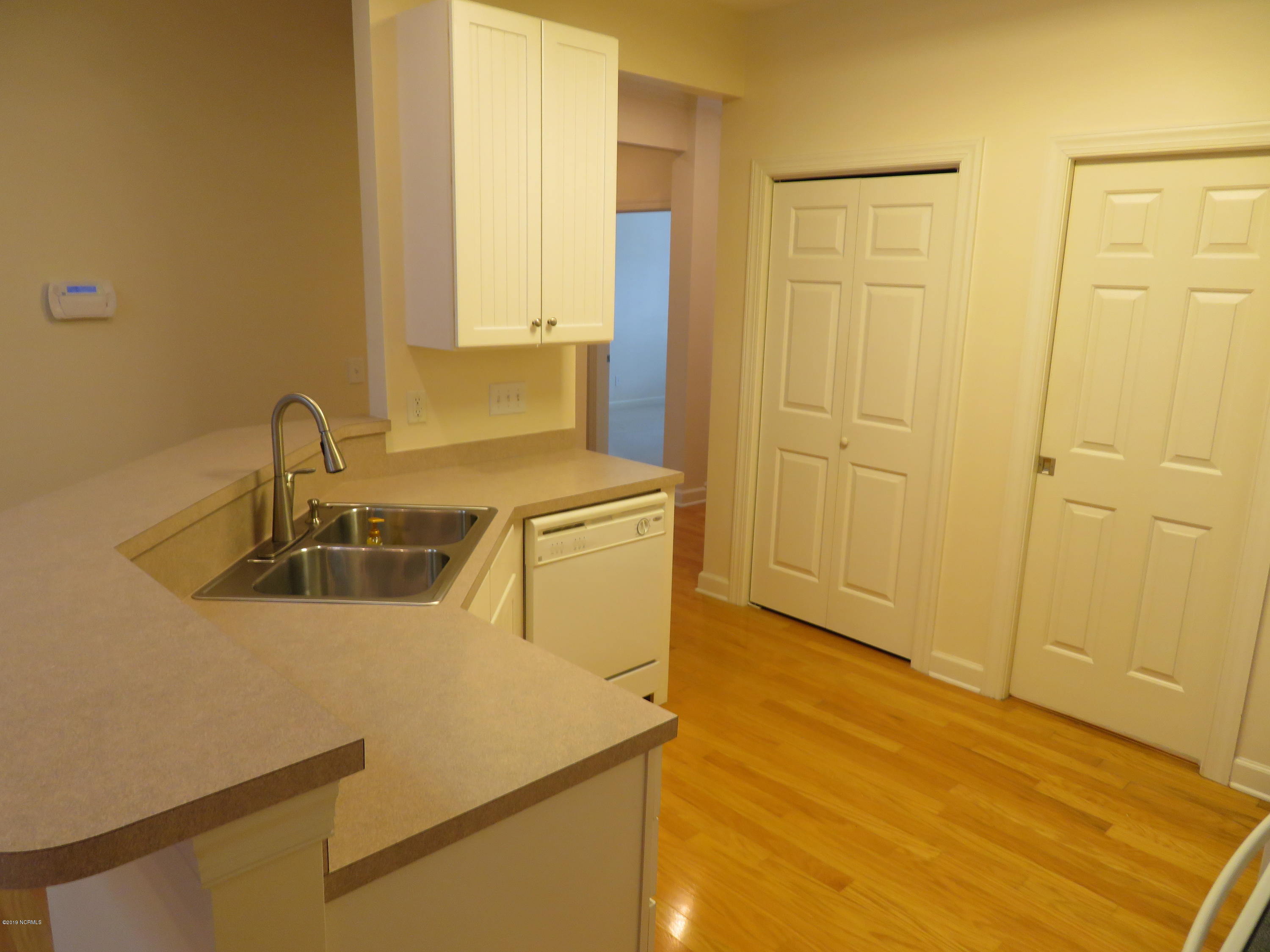 1306 Arbor Ridge Way Leland, NC 28451 - Photo 16 of 21 Kichen with large pantry and access to Laundry Room