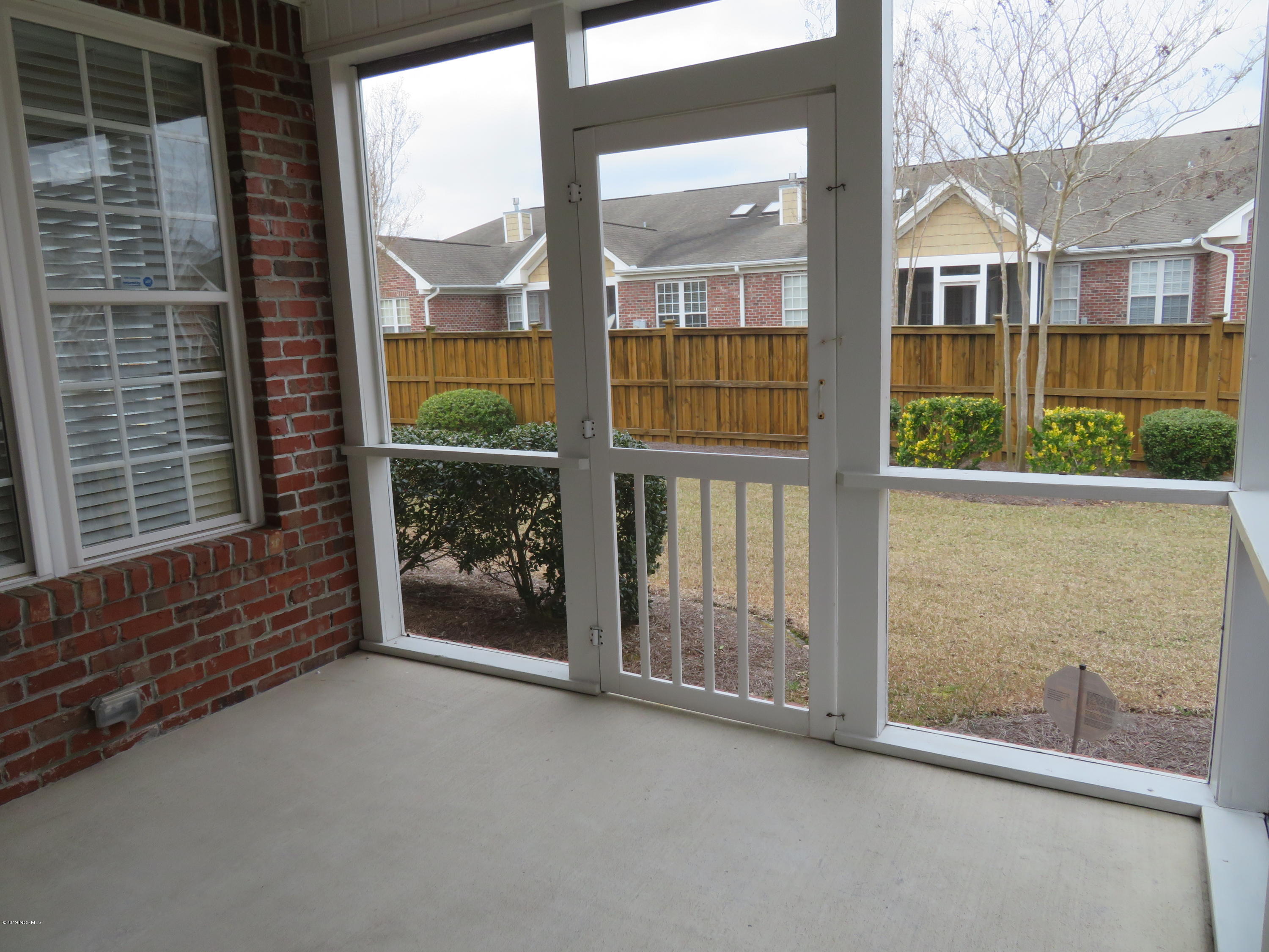 Rear Screened Porch with fenced rear yard and access to LR and Master Bedroom