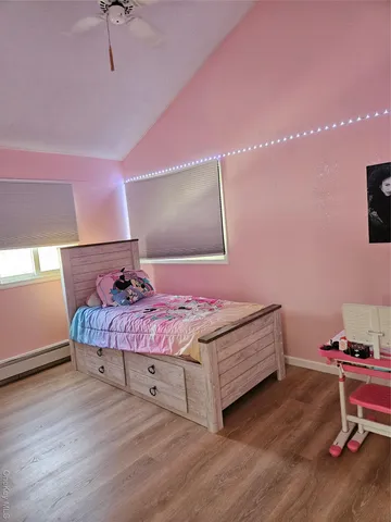 a bedroom with a bed and a chair