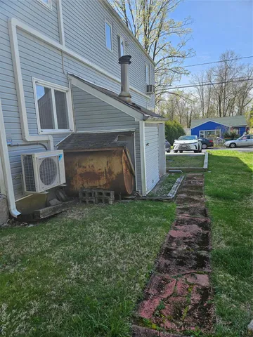 a couple of cars parked in front of a house