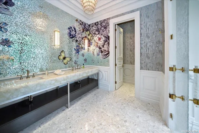 a spacious bathroom with a granite countertop sink a mirror and shower