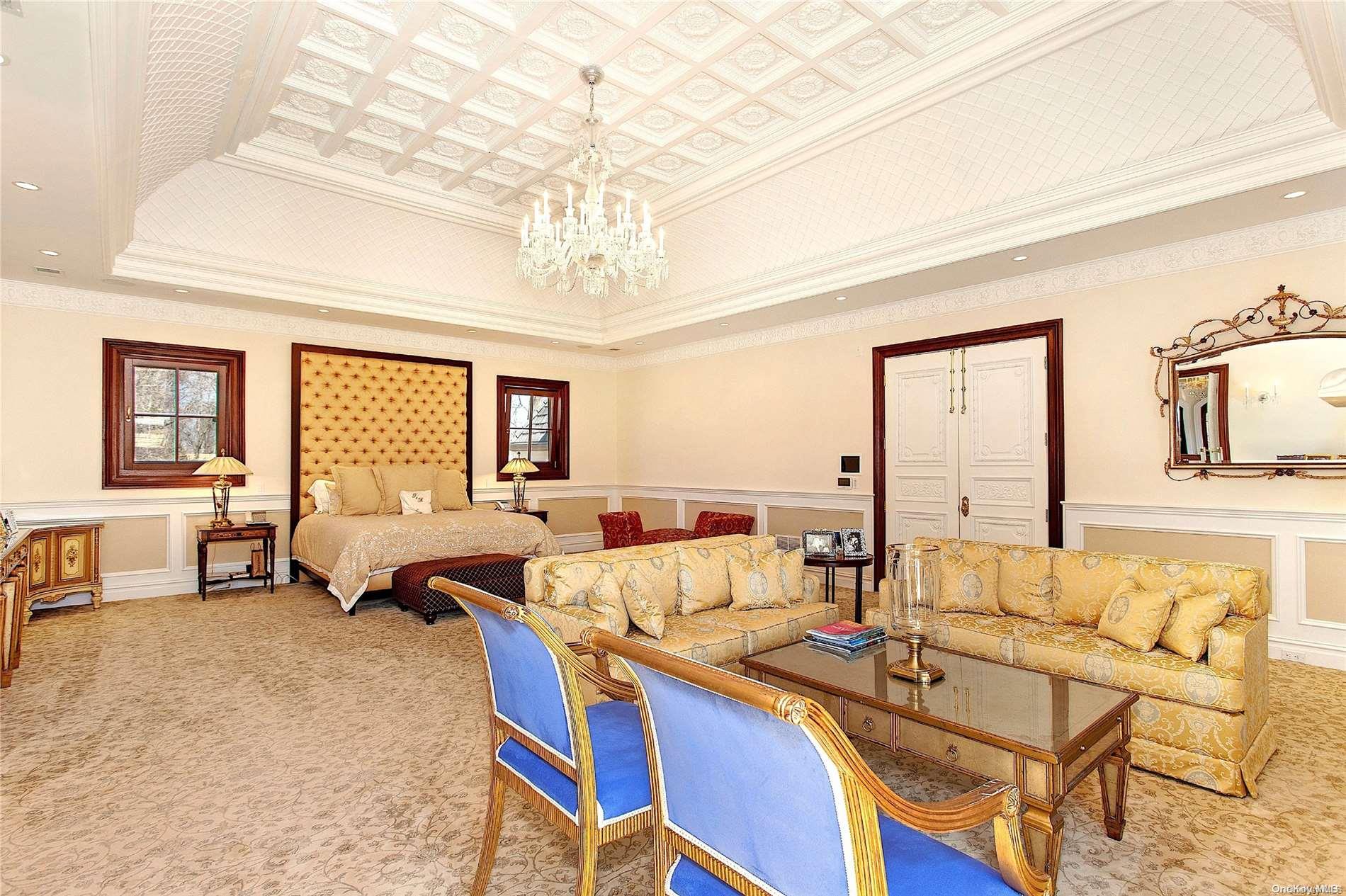 5 Longwood Road Sands Point, NY 11050 - Photo 17 of 27 a living room with furniture and a chandelier