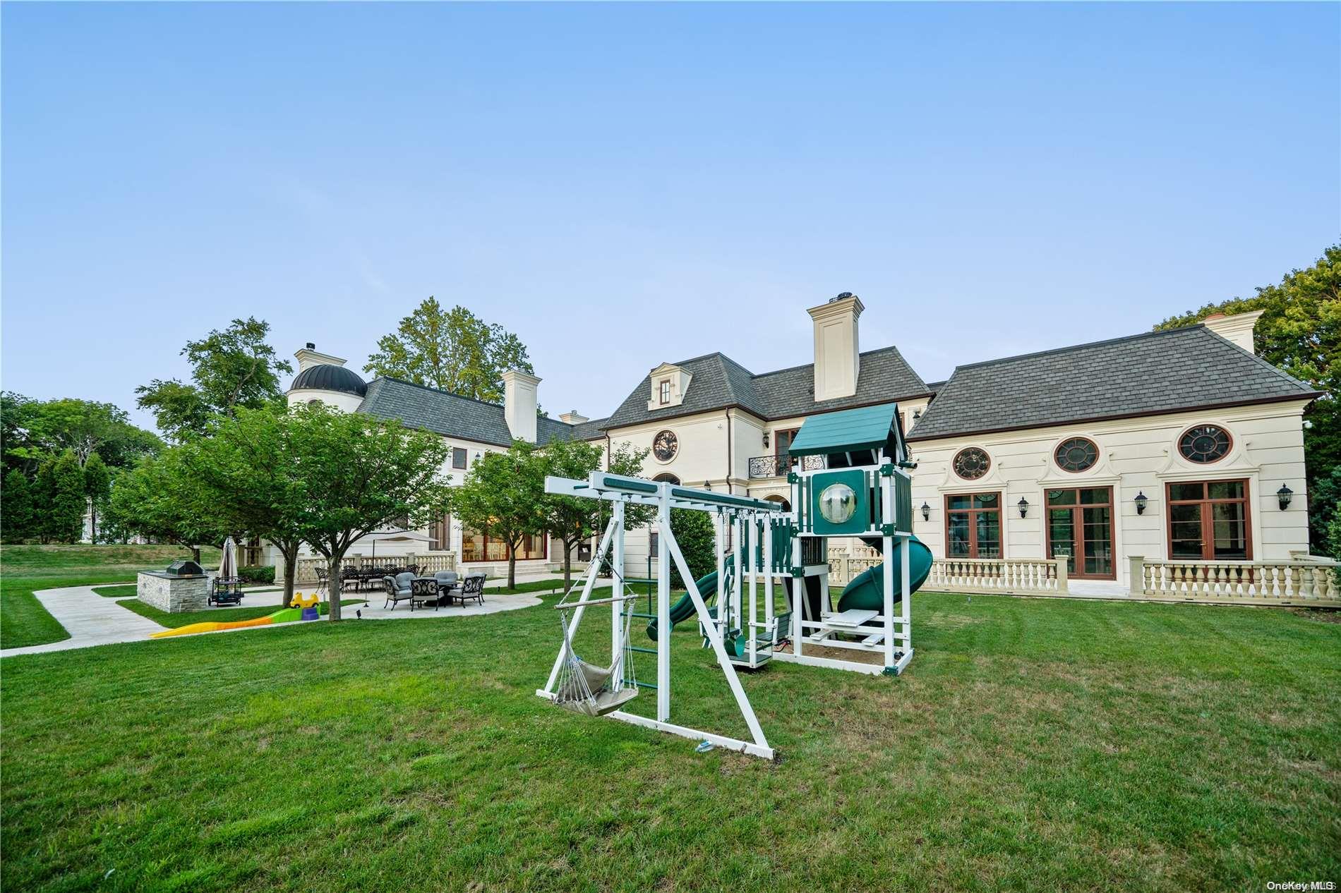 5 Longwood Road Sands Point, NY 11050 - Photo 23 of 27 a view of a house with a park