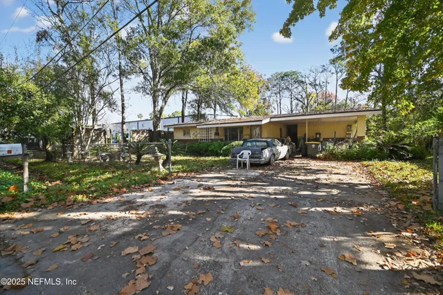 a view of a backyard with a patio
