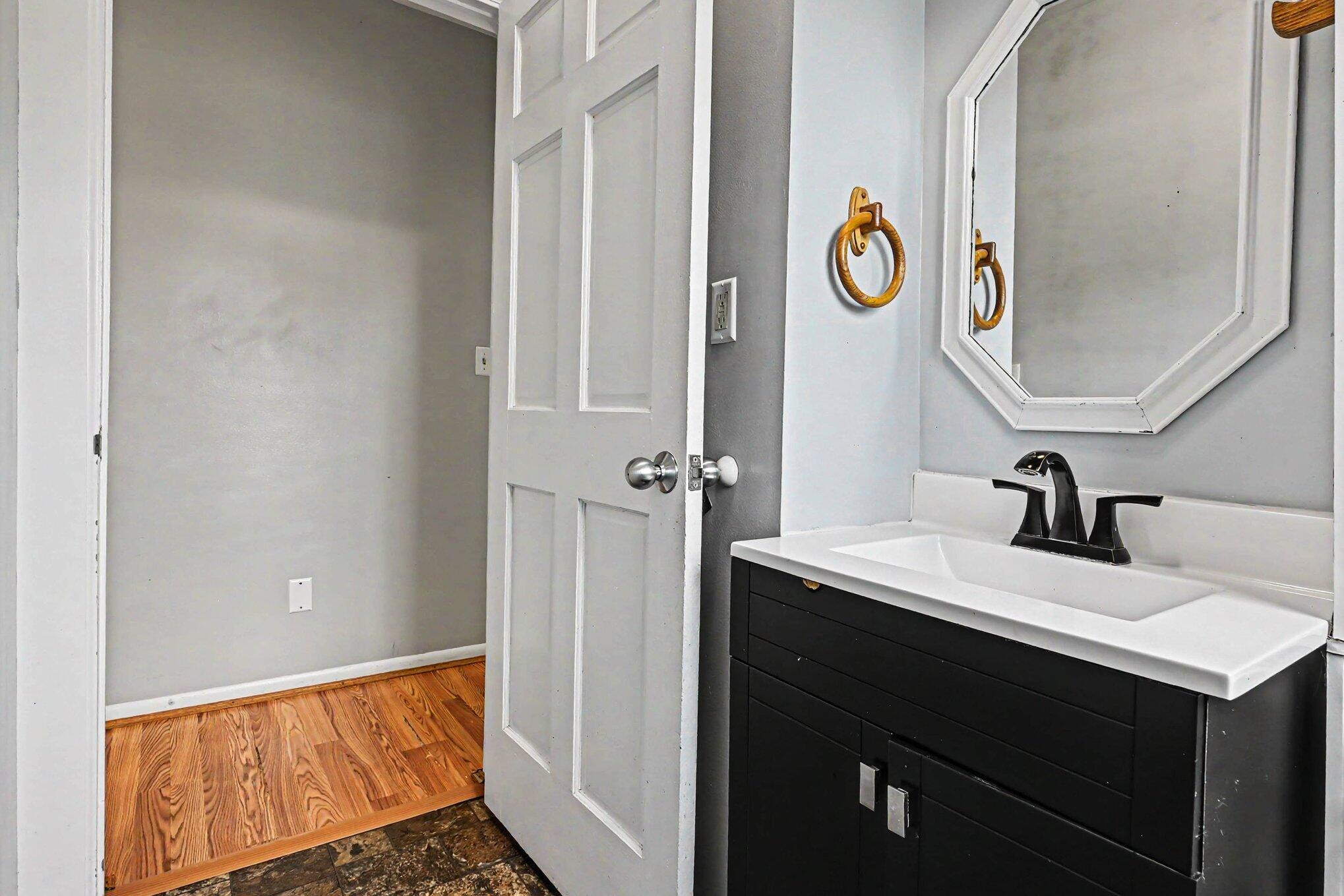 115 McClung Road La Porte, IN 46350 - Photo 13 of 31 a bathroom with a sink and a mirror