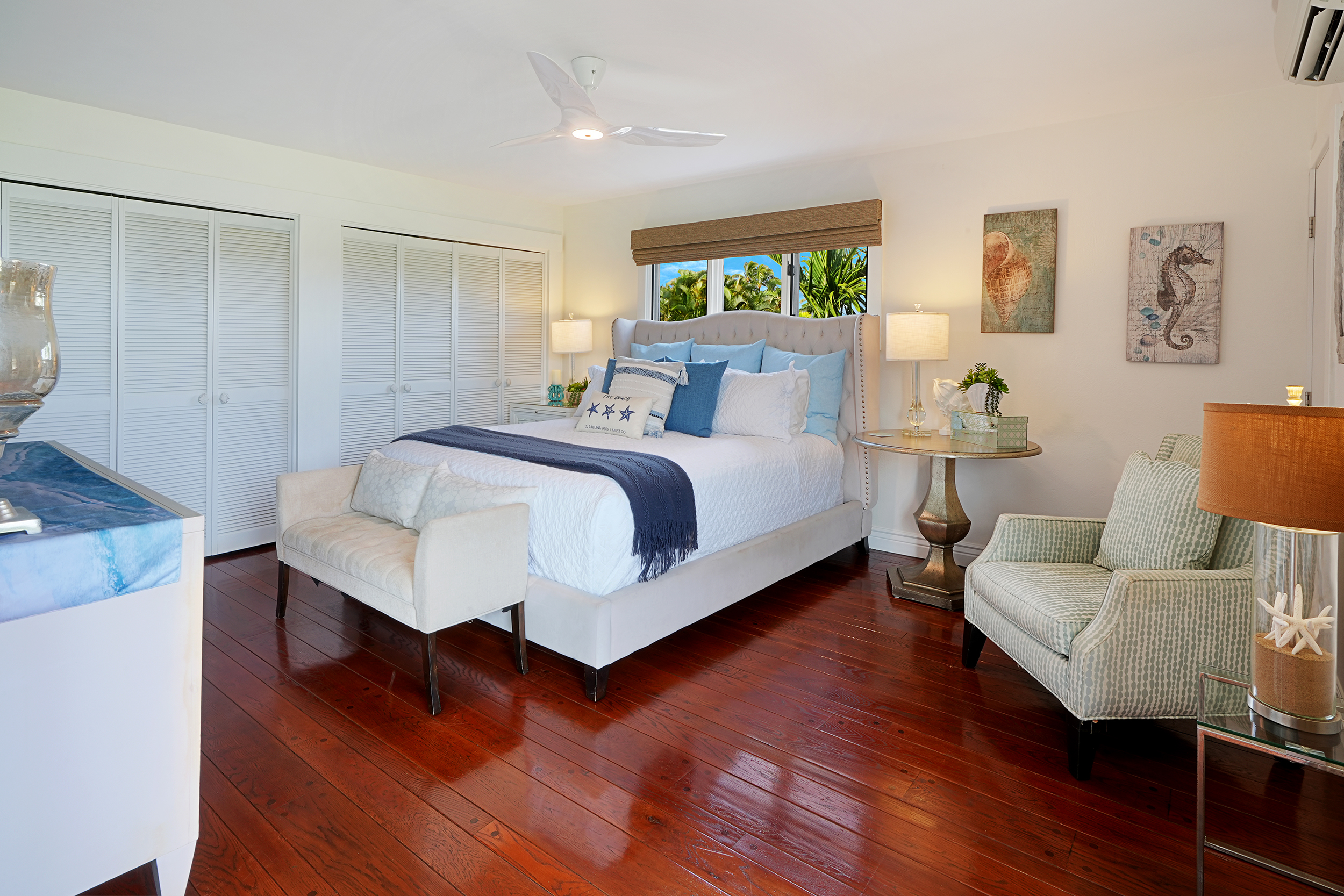 5348 Honoiki Road Princeville, HI 96722 - Photo 12 of 25 a spacious bedroom with a bed and a couch