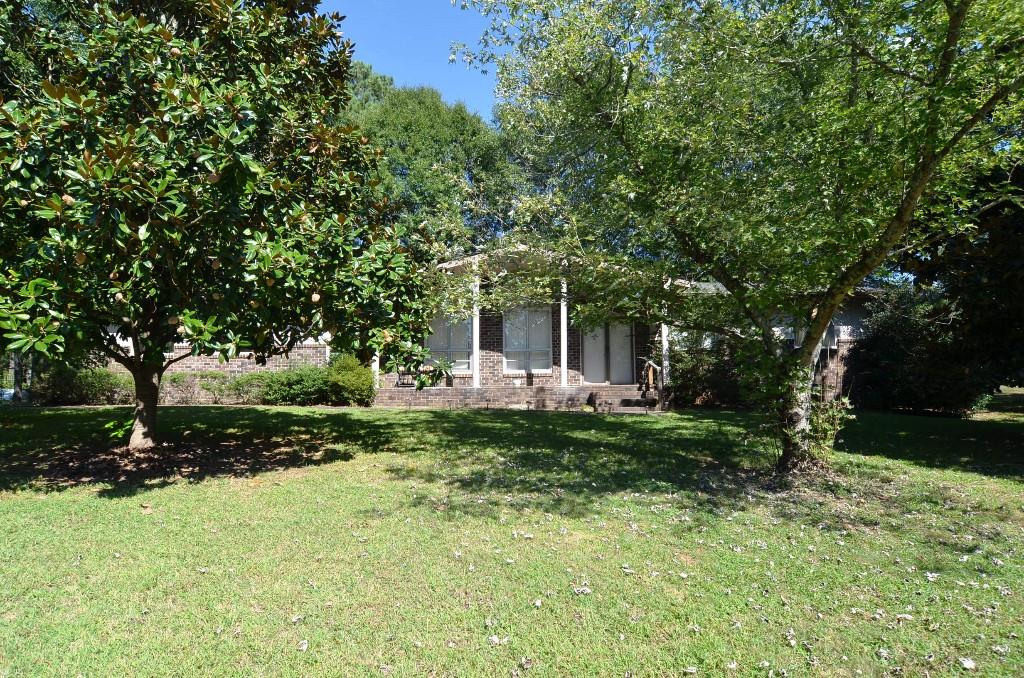 Front of home! Four sides brick home! Cherry tree, pecan tree, magnolia tree, blueberry and blackberry bushes as well!