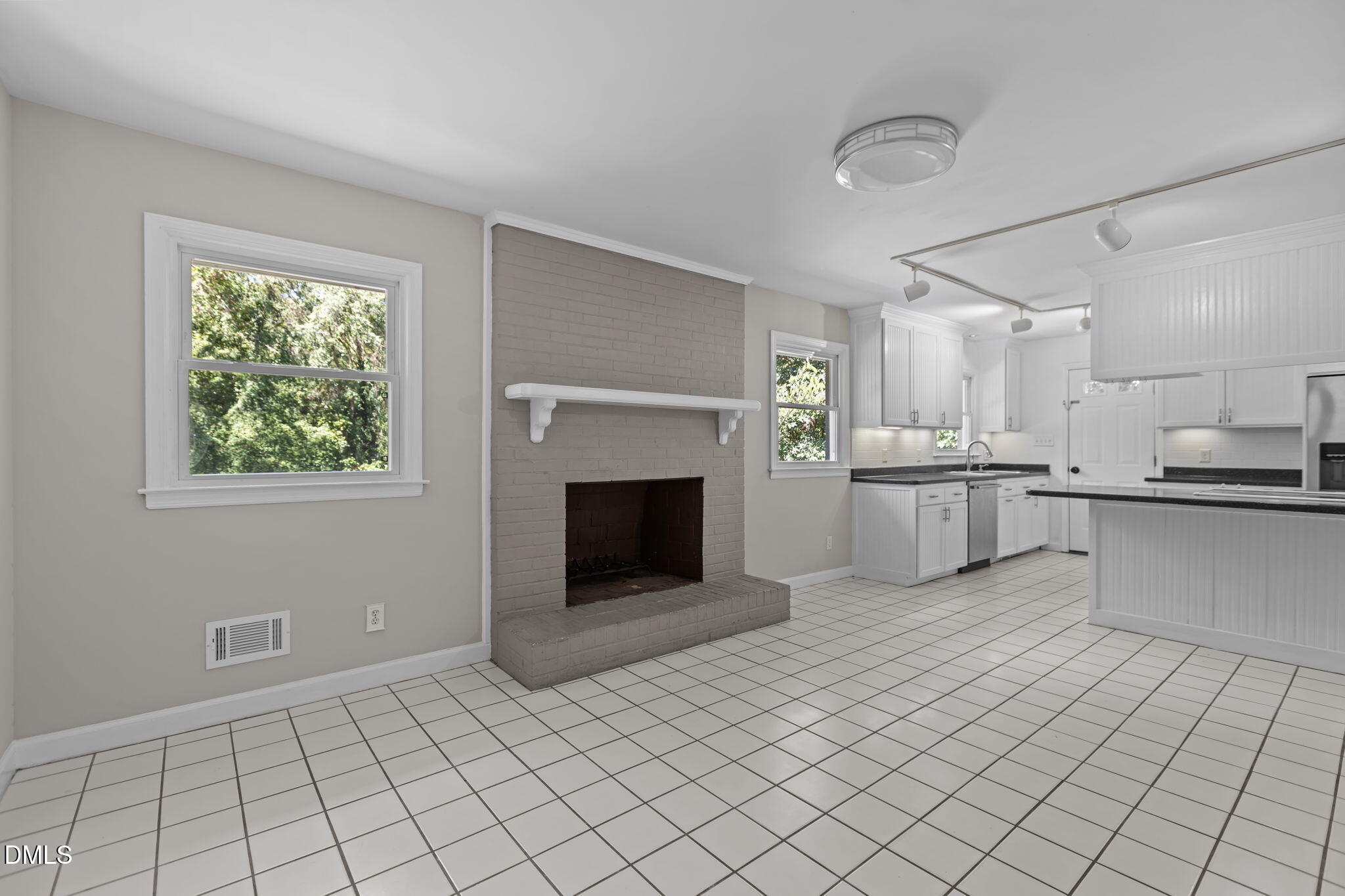 3117 Edgetone Drive Raleigh, NC 27604 - Photo 11 of 50 a view of a kitchen with furniture and a fireplace