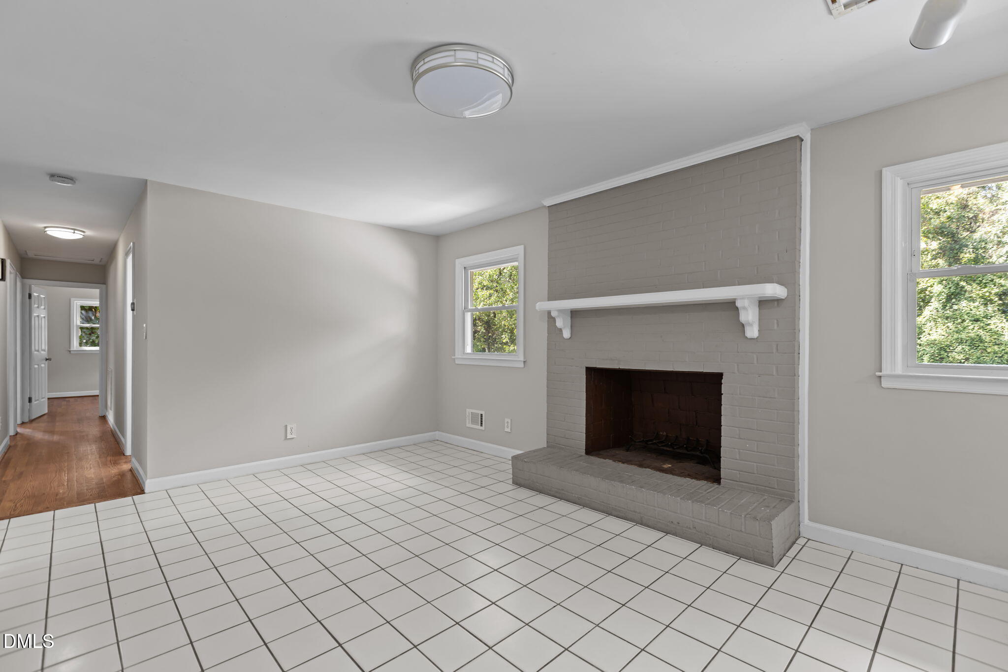 3117 Edgetone Drive Raleigh, NC 27604 - Photo 13 of 50 a view of an empty room with window and fire place