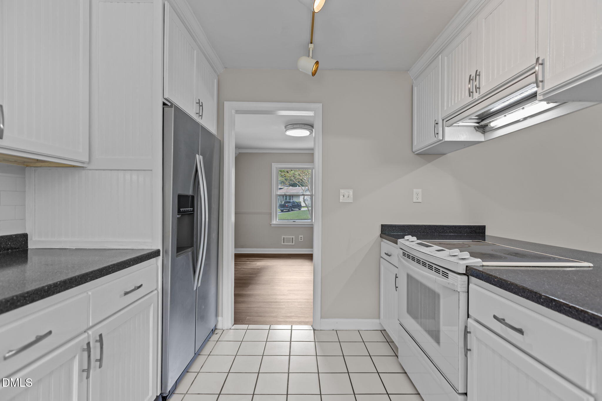 3117 Edgetone Drive Raleigh, NC 27604 - Photo 18 of 50 a kitchen with stainless steel appliances granite countertop a refrigerator and a sink