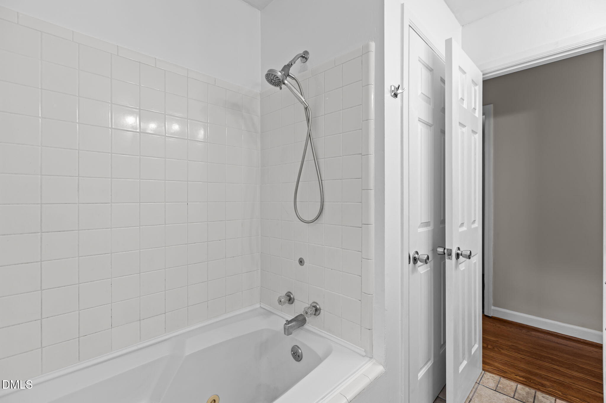 3117 Edgetone Drive Raleigh, NC 27604 - Photo 20 of 50 a bathroom with a bath tub with a shower