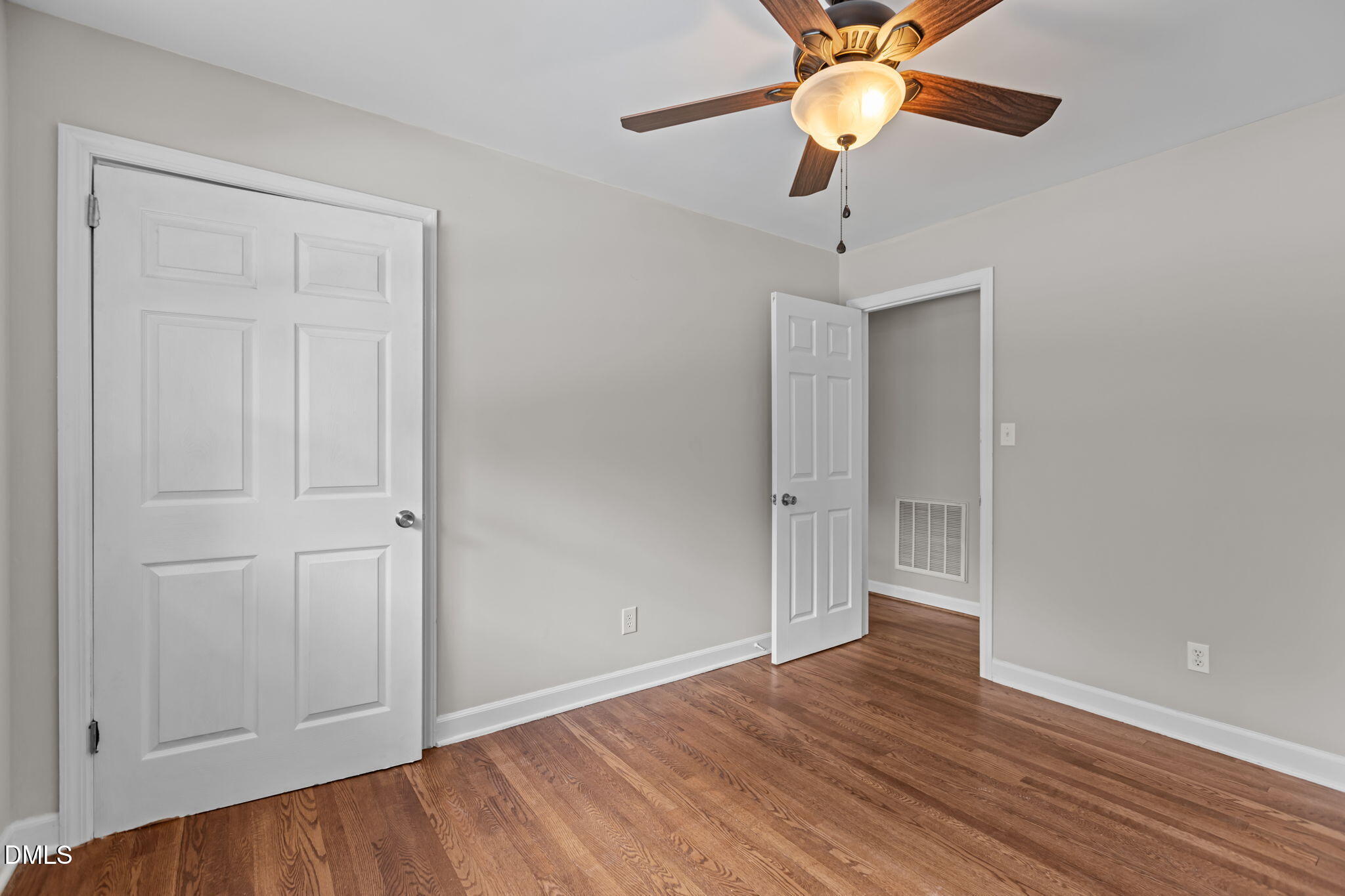 3117 Edgetone Drive Raleigh, NC 27604 - Photo 22 of 50 a view of an empty room with wooden floor