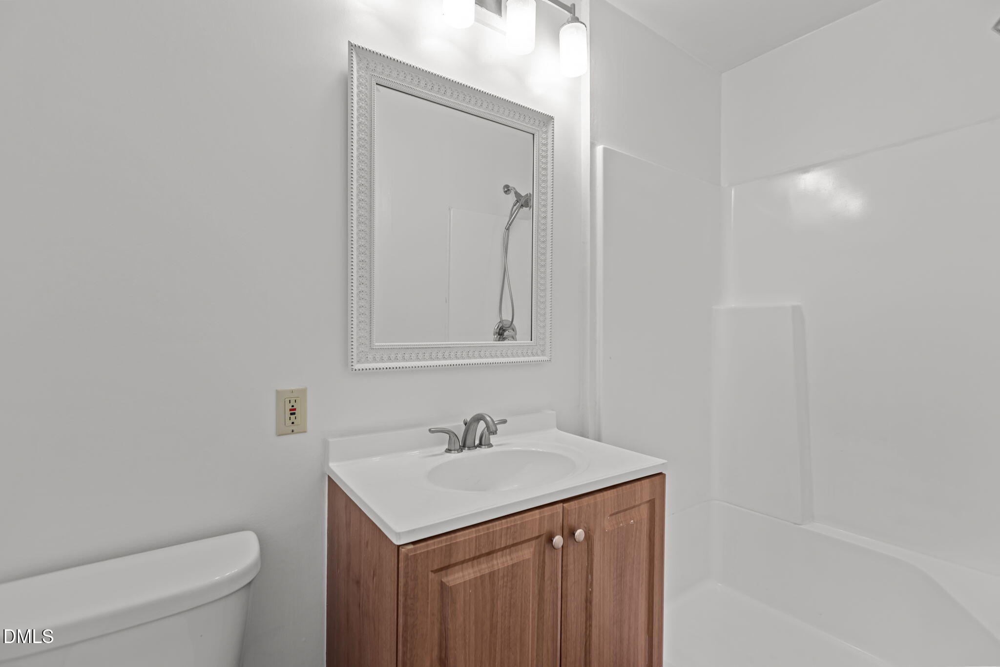 3117 Edgetone Drive Raleigh, NC 27604 - Photo 27 of 50 a bathroom with a sink toilet and vanity