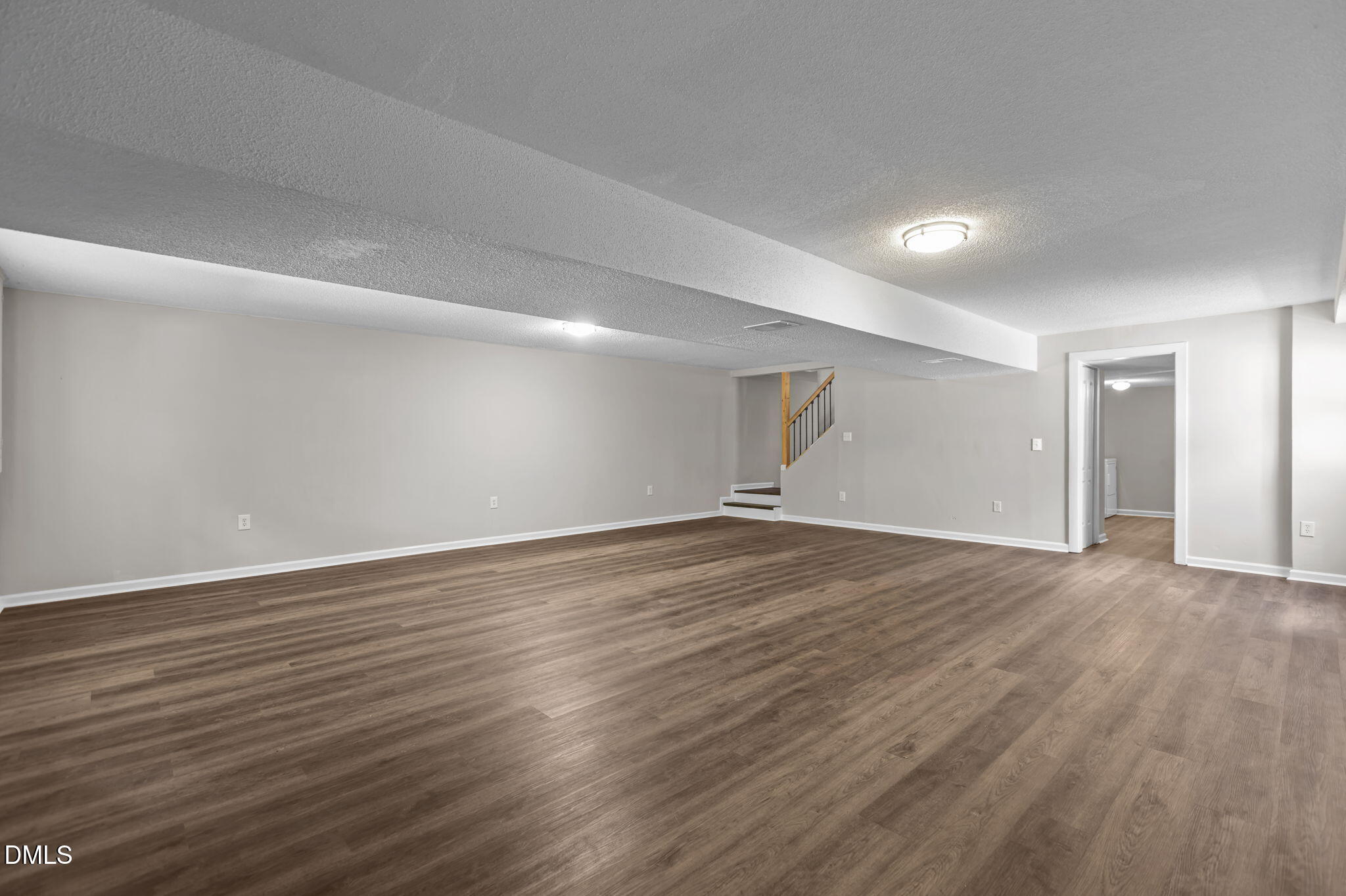 3117 Edgetone Drive Raleigh, NC 27604 - Photo 31 of 50 a view of an empty room with wooden floor