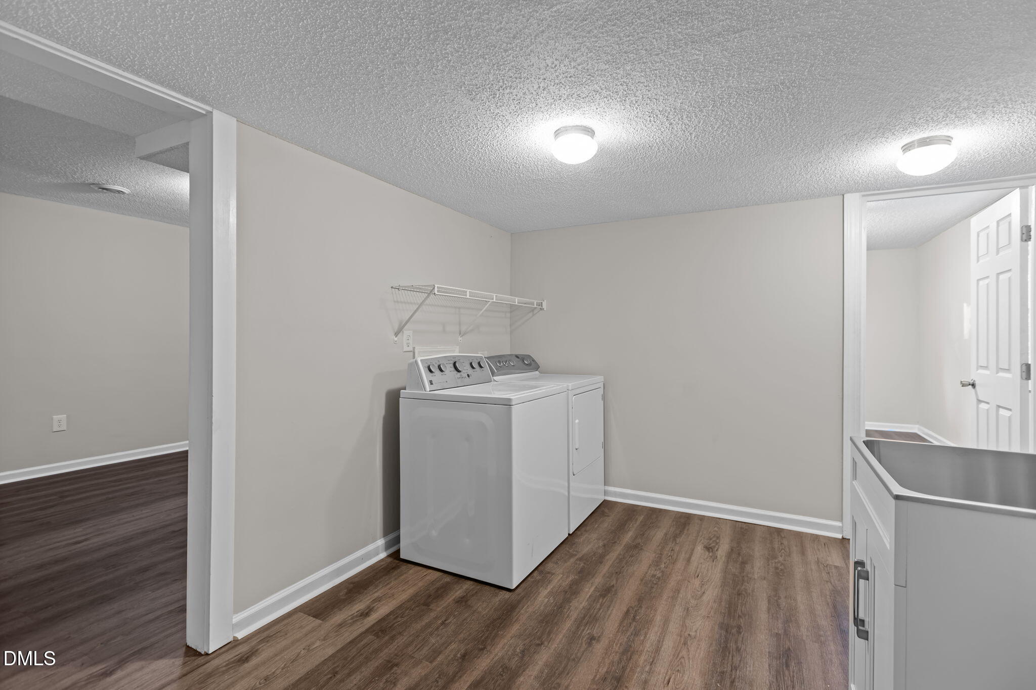 3117 Edgetone Drive Raleigh, NC 27604 - Photo 32 of 50 a utility room with wooden floor washer and dryer