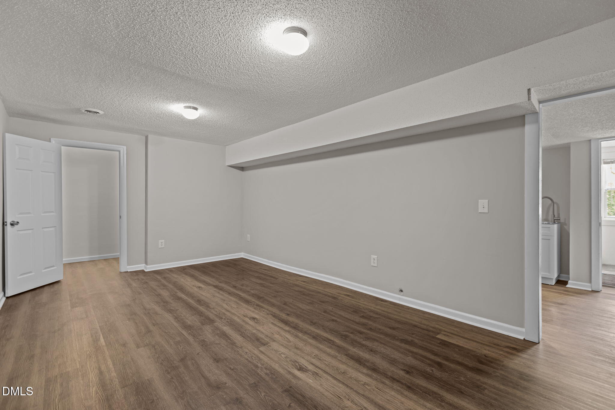 3117 Edgetone Drive Raleigh, NC 27604 - Photo 38 of 50 a view of an empty room with wooden floor