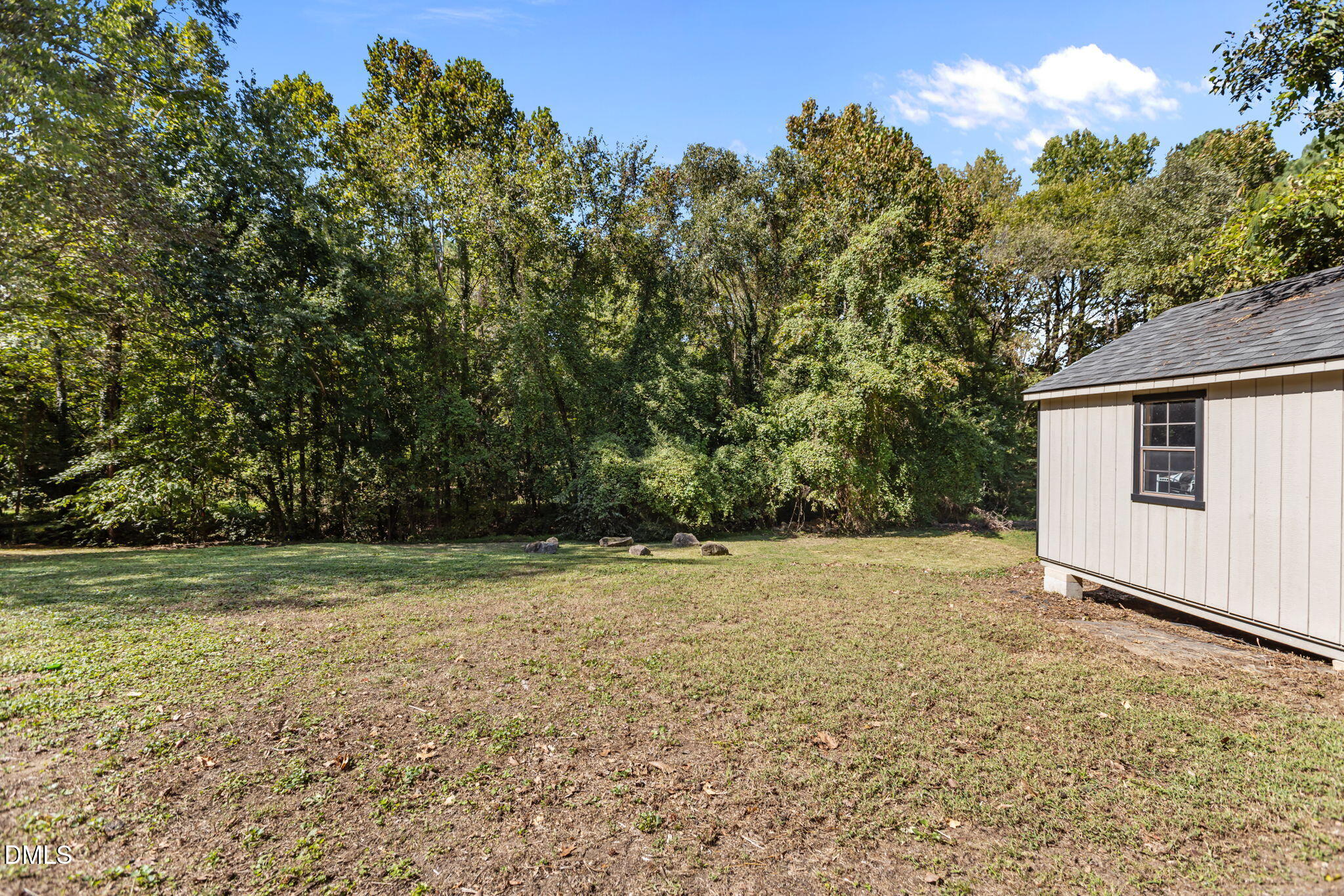 3117 Edgetone Drive Raleigh, NC 27604 - Photo 41 of 50 a view of a yard with a tree