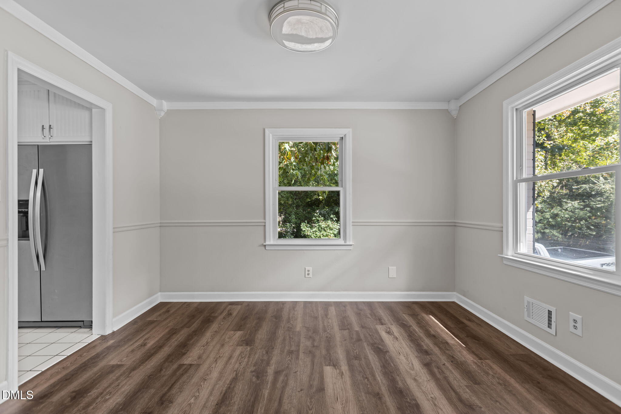 3117 Edgetone Drive Raleigh, NC 27604 - Photo 8 of 50 a view of empty room with wooden floor and fan