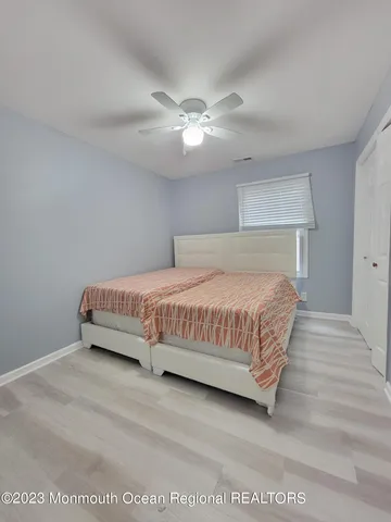 a bedroom with a bed and lamp