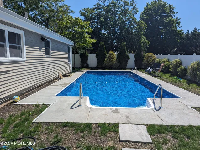 a view of a backyard with a patio