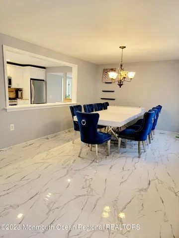 a living room with furniture and a lamp