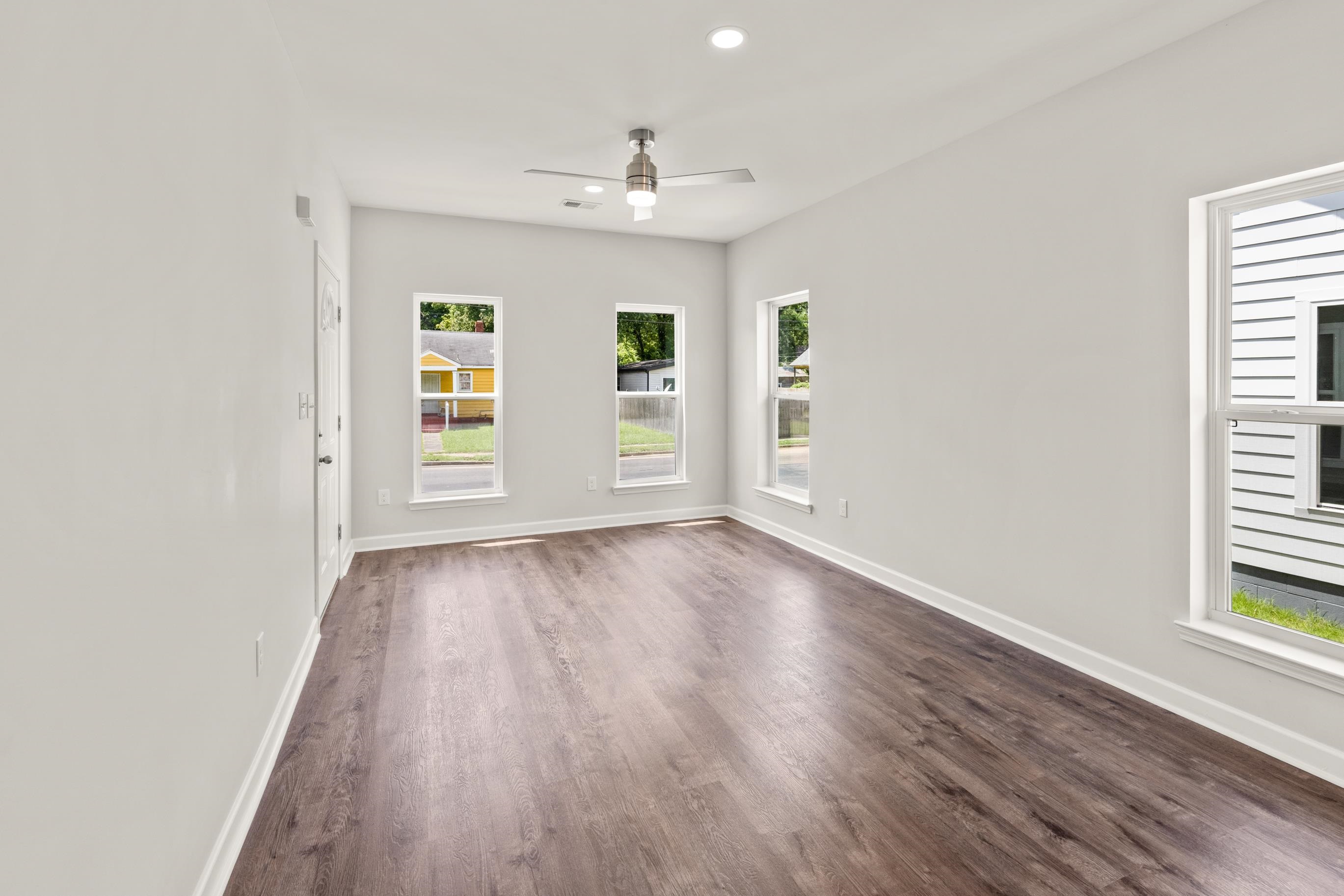 820 Semmes Street Memphis, TN 38111 - Photo 10 of 15 an empty room with wooden floor and windows