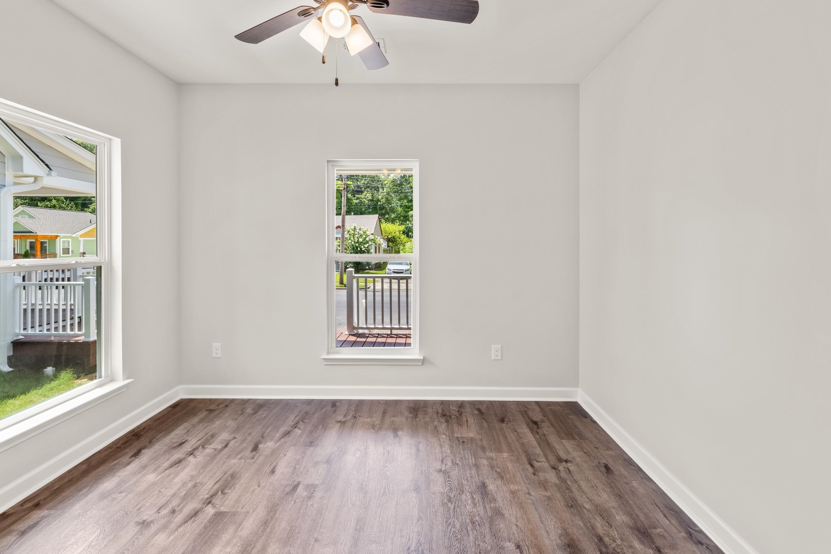 820 Semmes Street Memphis, TN 38111 - Photo 13 of 15 a view of an empty room with a window and wooden floor