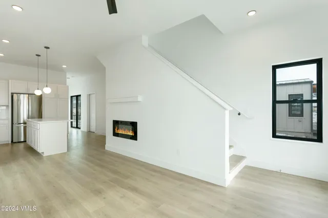 a bathroom with a granite countertop toilet sink and mirror