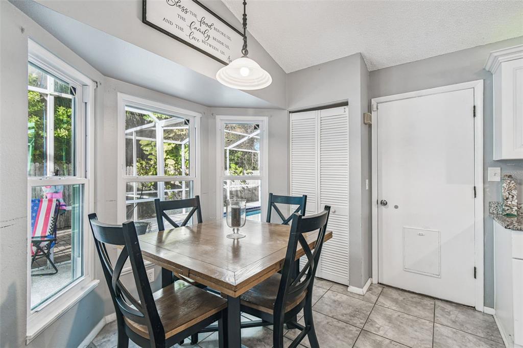 7501 Fawn Lake Road New Port Richey, FL 34655 - Photo 12 of 27 a view of a dining room with furniture and window