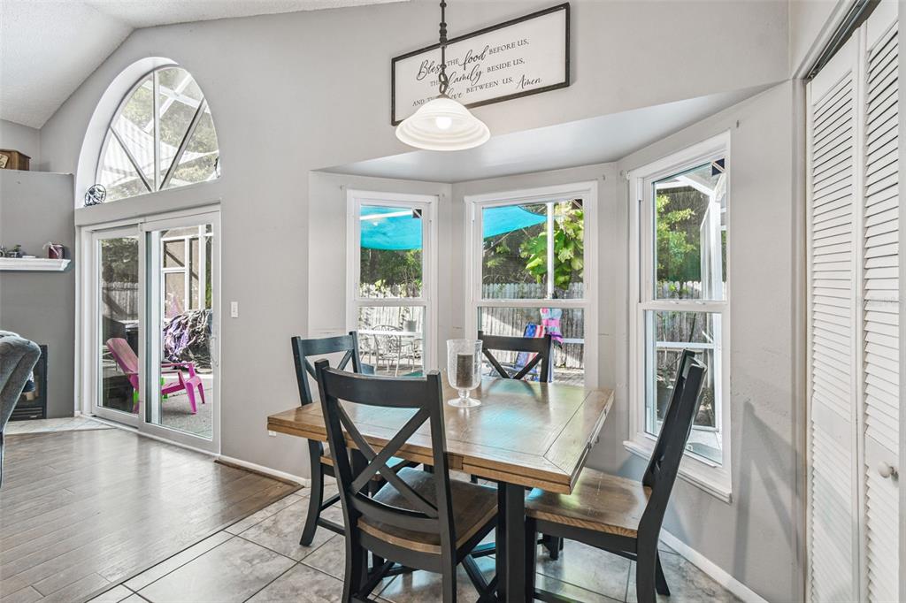 7501 Fawn Lake Road New Port Richey, FL 34655 - Photo 13 of 27 a view of a dining room with furniture window and outside view