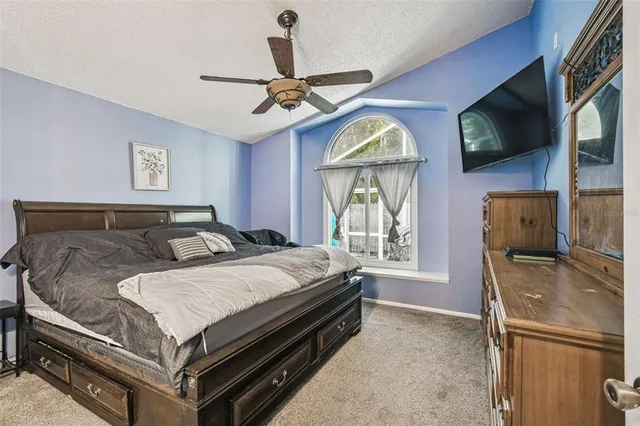 a bathroom with a double vanity sink a large mirror and a shower