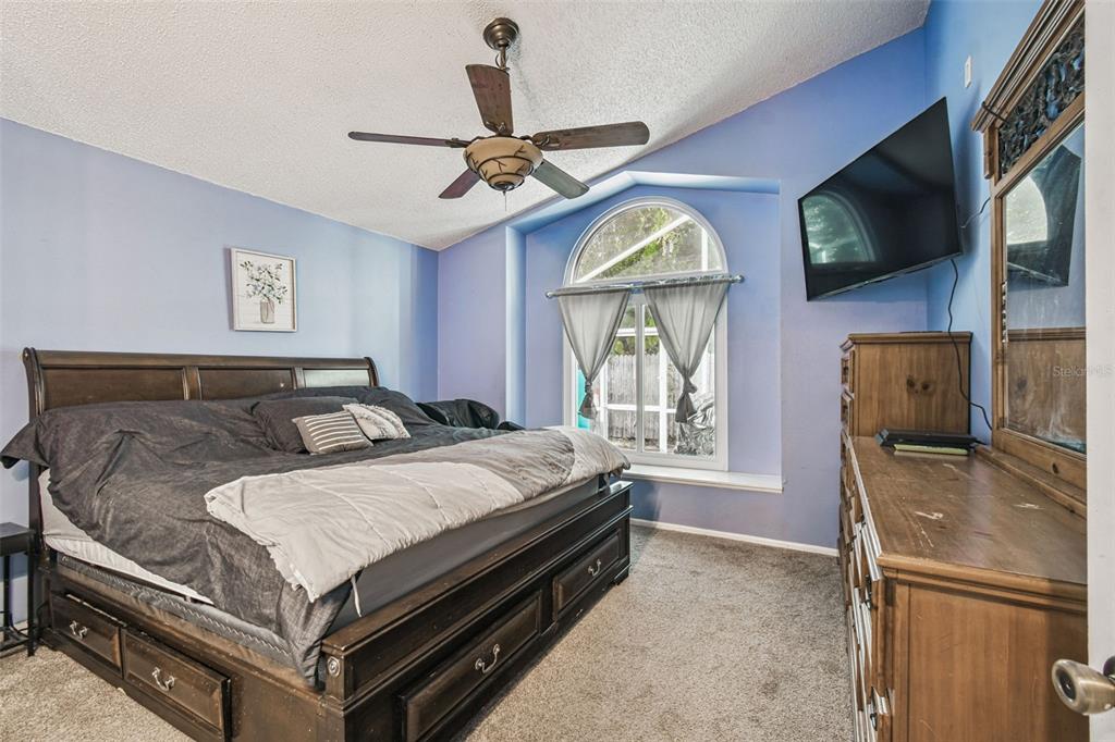 7501 Fawn Lake Road New Port Richey, FL 34655 - Photo 17 of 27 a bed sitting in a room next to a window