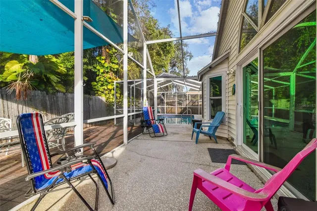 a view of balcony with wooden floor and outdoor seating