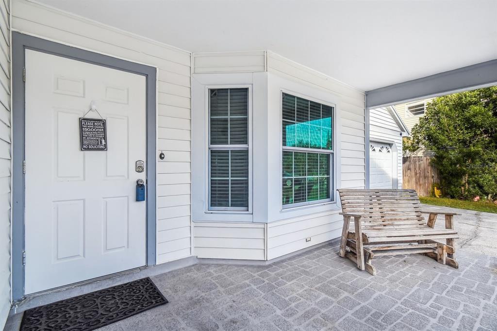 7501 Fawn Lake Road New Port Richey, FL 34655 - Photo 5 of 27 a living room with a chair and a window