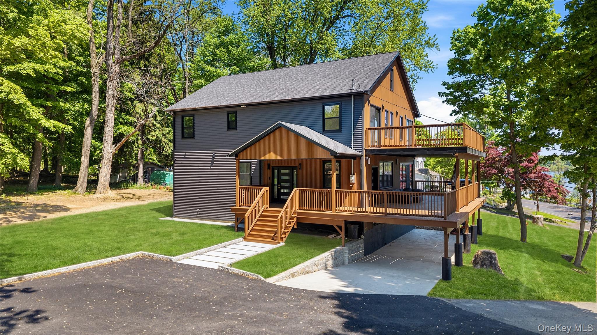 548 Lakes Road Monroe, NY 10950 - Photo 1 of 50 a front view of a house with garden