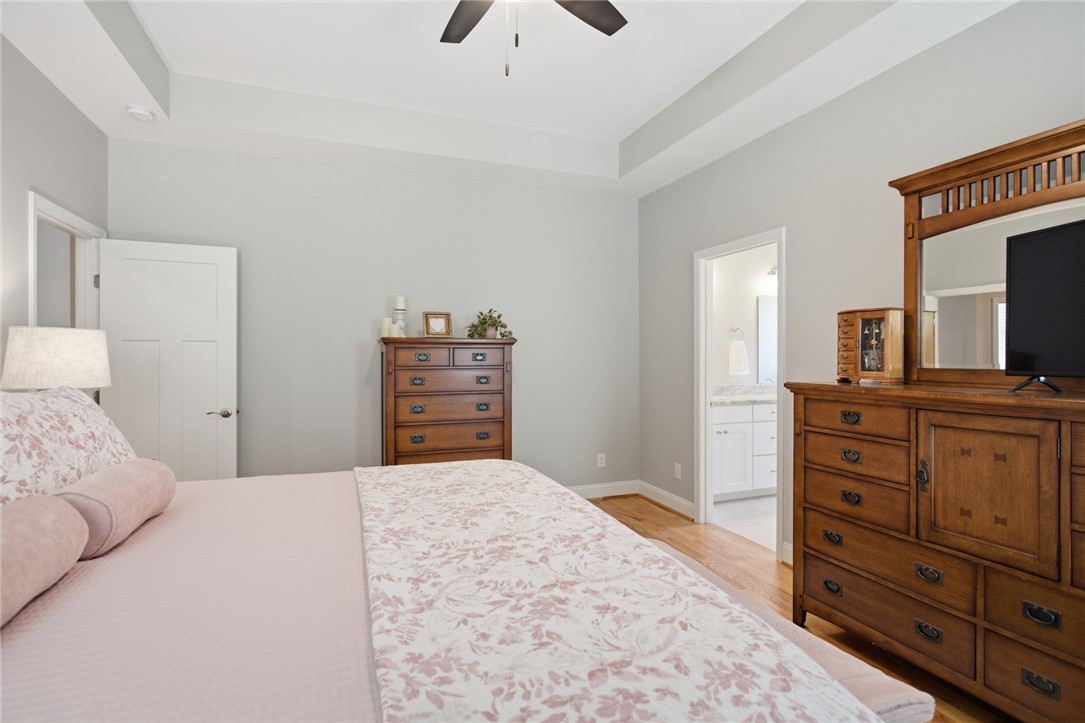 105 Winterbrook Circle Seneca, SC 29678 - Photo 21 of 48 This tranquil bedroom features high ceilings and hardwood flooring, with convenient access to an en suite bathroom.