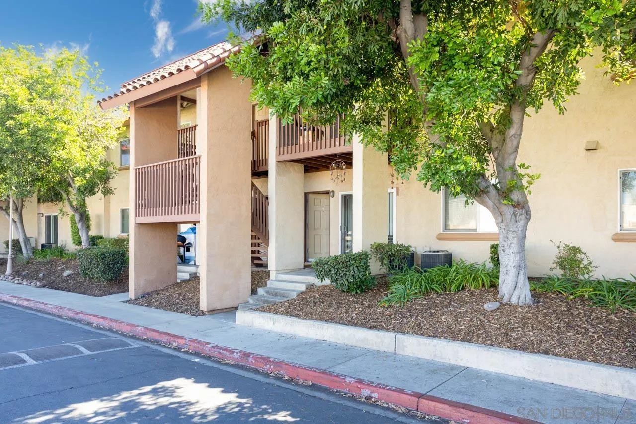 180 Chambers Street, Unit 4 El Cajon, CA 92020 - Photo 25 of 27 a front view of a house with a yard and garage