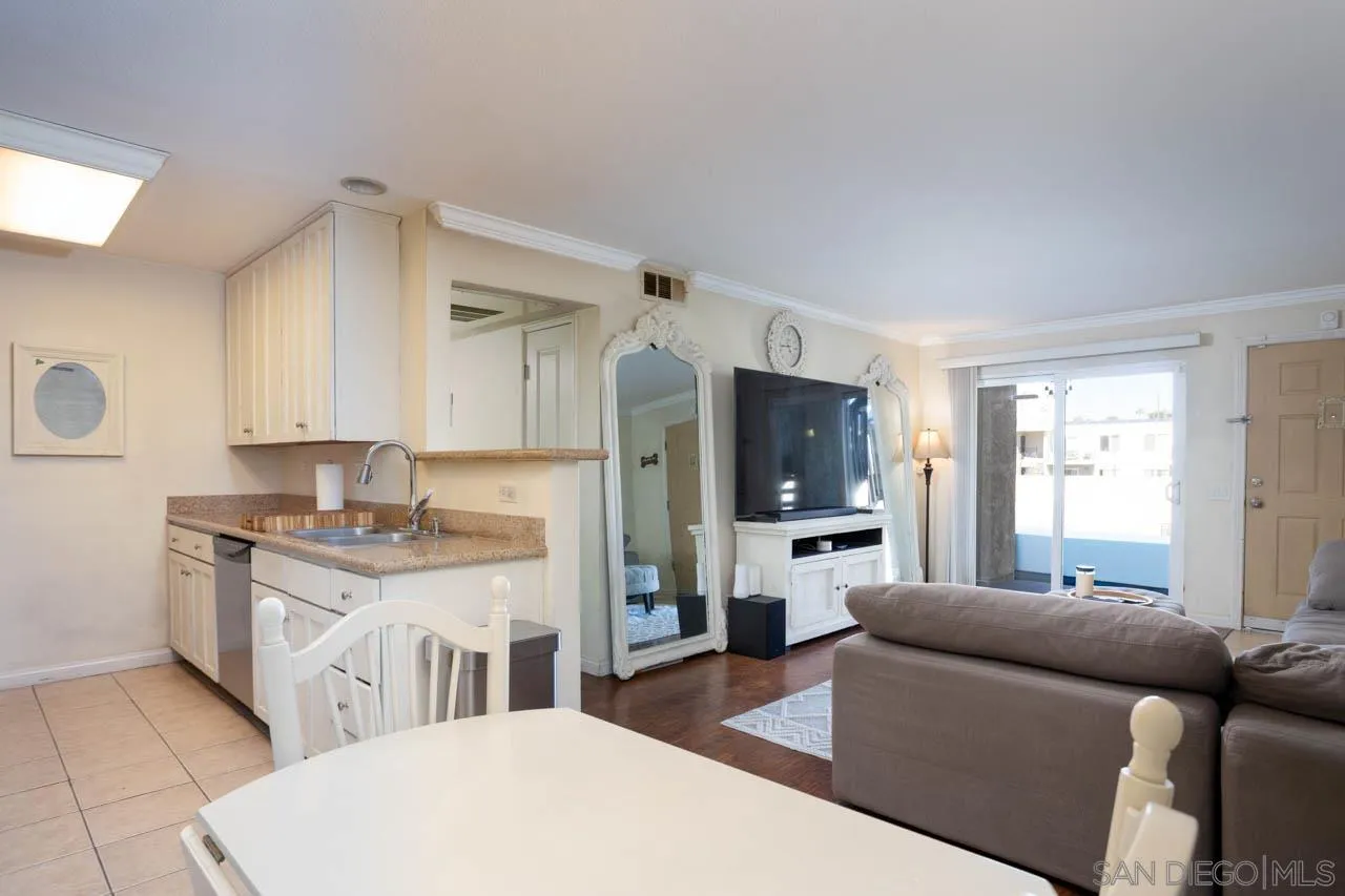 180 Chambers Street, Unit 4 El Cajon, CA 92020 - Photo 3 of 27 a living room with furniture and a flat screen tv