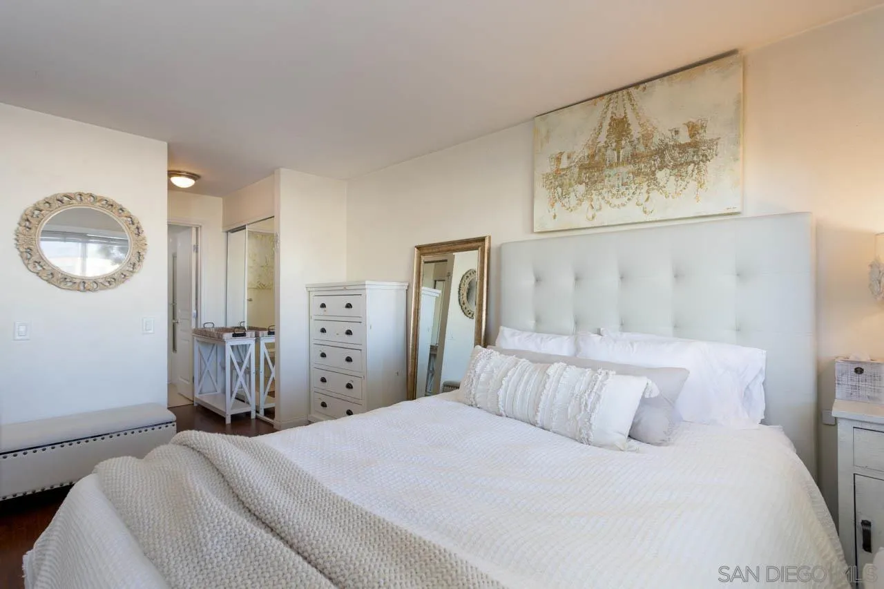 180 Chambers Street, Unit 4 El Cajon, CA 92020 - Photo 9 of 27 a bedroom with a bed and a chandelier